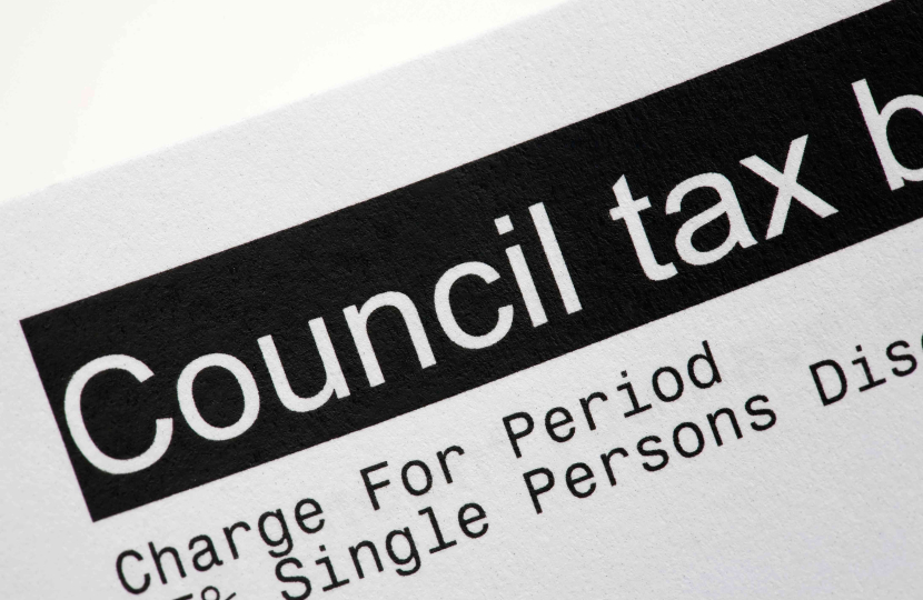 A close-up of a document with the heading Council tax bill in bold black text, featuring Westminster City Council details, showing part of the bill including charges and exemptions.
