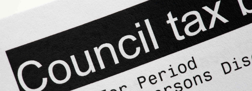 A close-up of a document with the heading Council tax bill in bold black text, featuring Westminster City Council details, showing part of the bill including charges and exemptions.