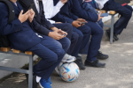 Stock image of school children with mobiles (credit Vladimir adobe.stock.com)