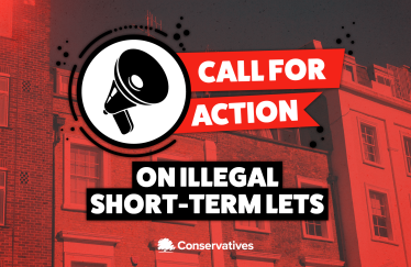 Red campaign banner with town houses background