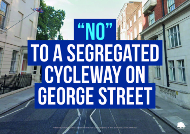 A street scene with the words: NO TO A SEGREGATED CYCLEWAY ON GEORGE STREET in bold white and blue text over the image, highlighting the stance of local Conservatives